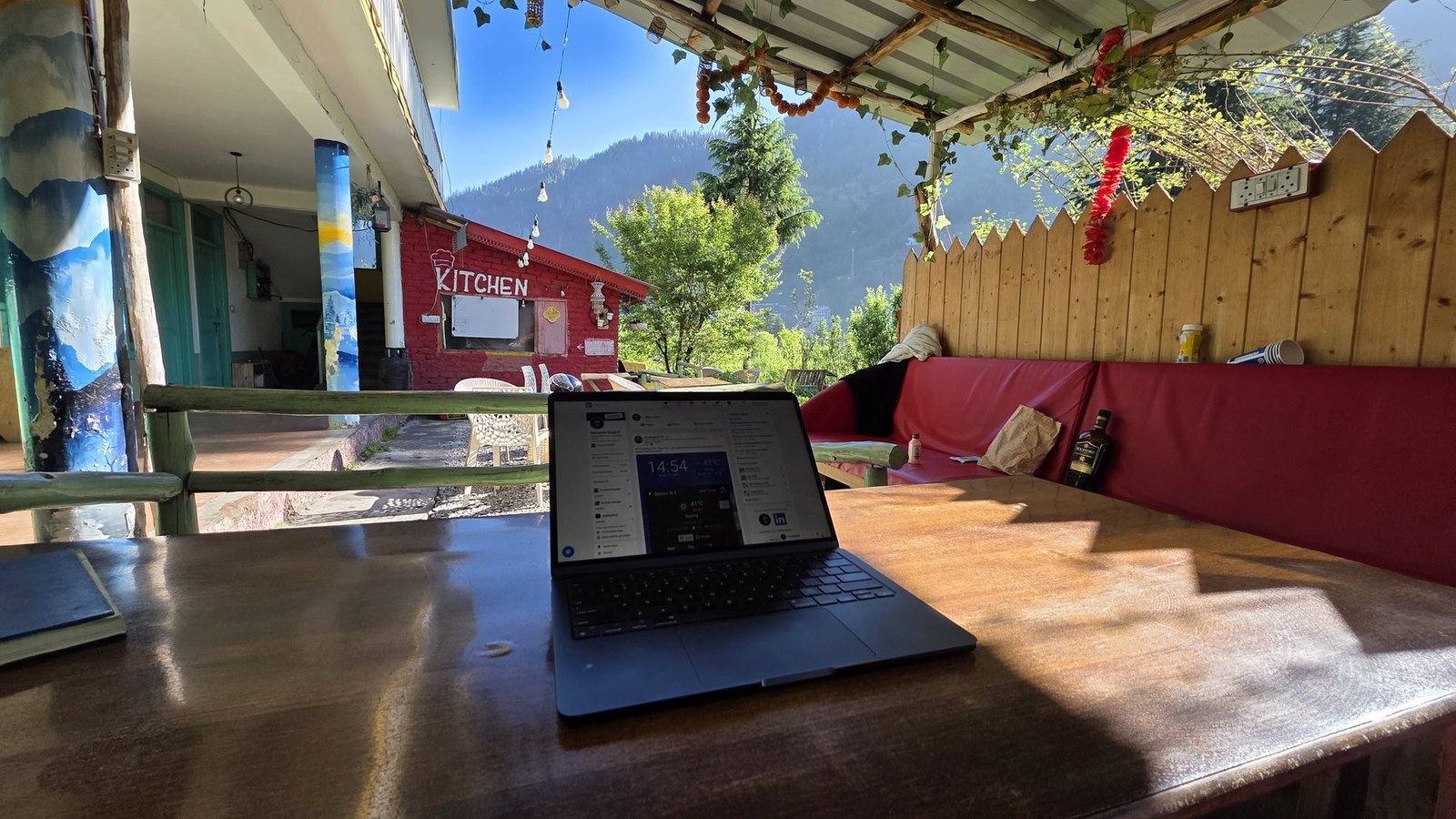 Laptop on a table in Safar Hostel's outdoor café area