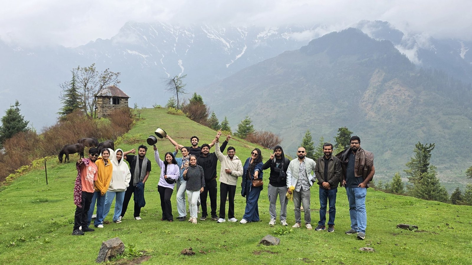 Safar travellers together on a green hillside