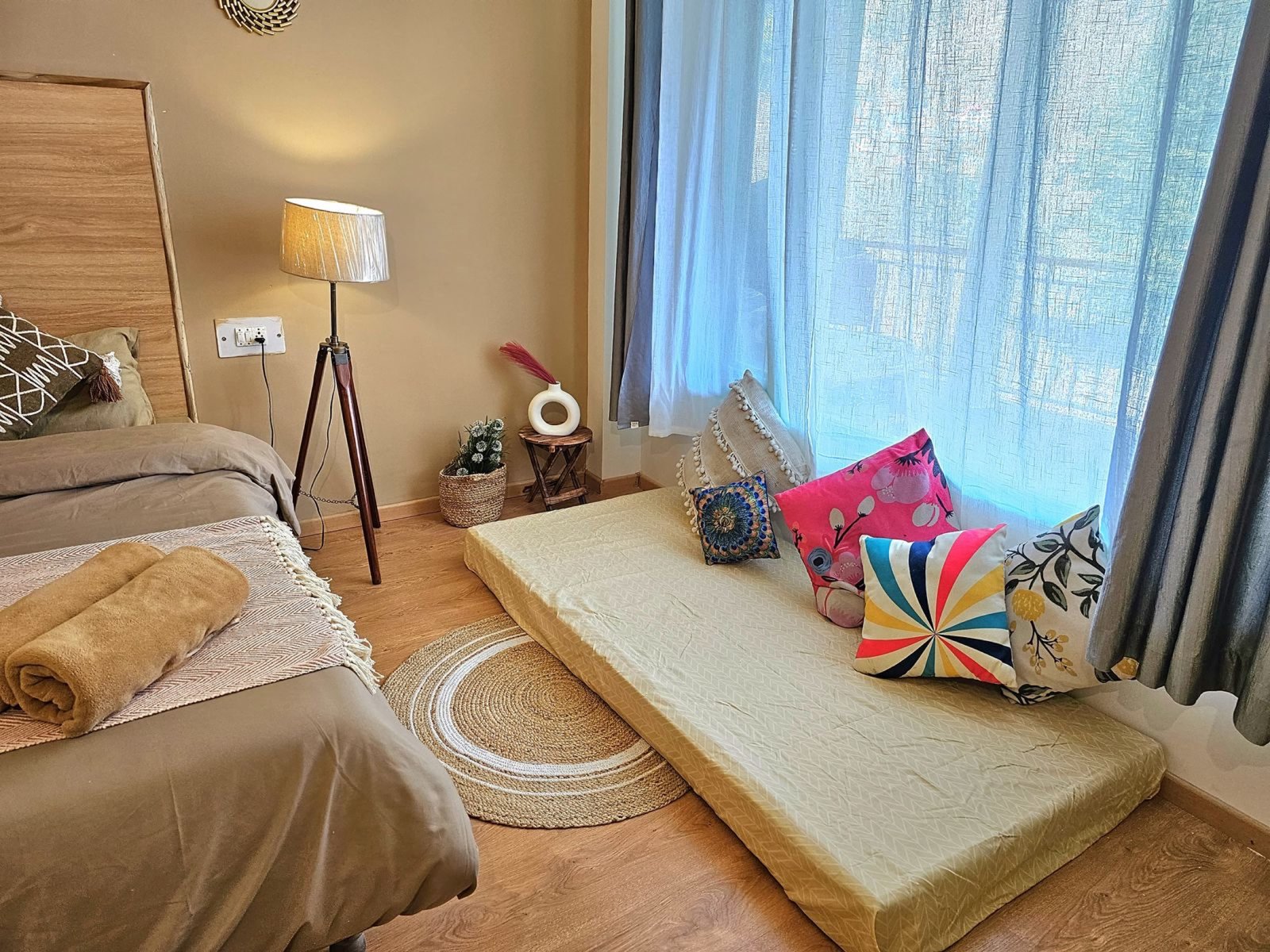 Window-side seating inside Safar Hostel's Premium Room