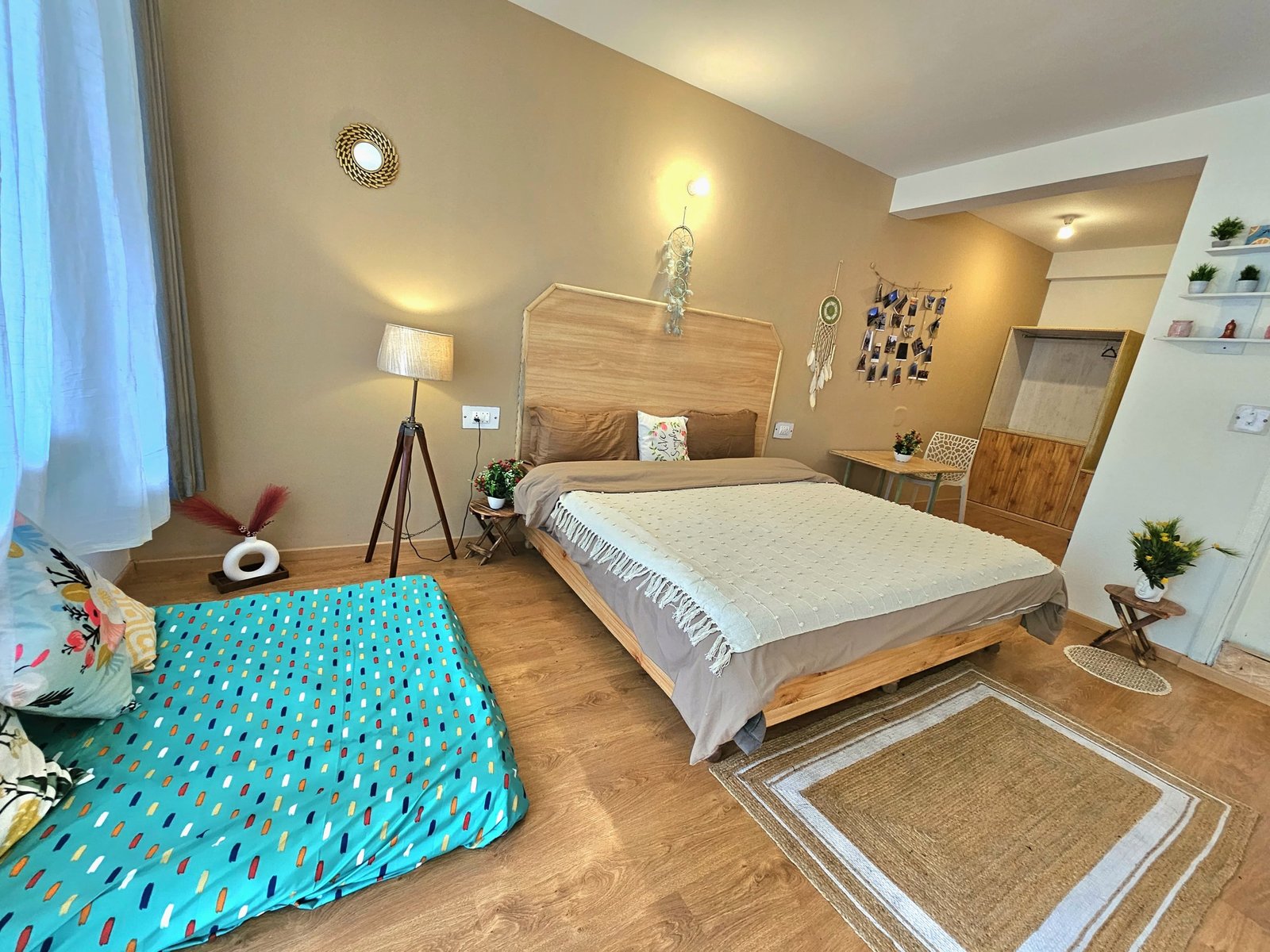 Safar Hostel Premium Room with double bed and separate seating area