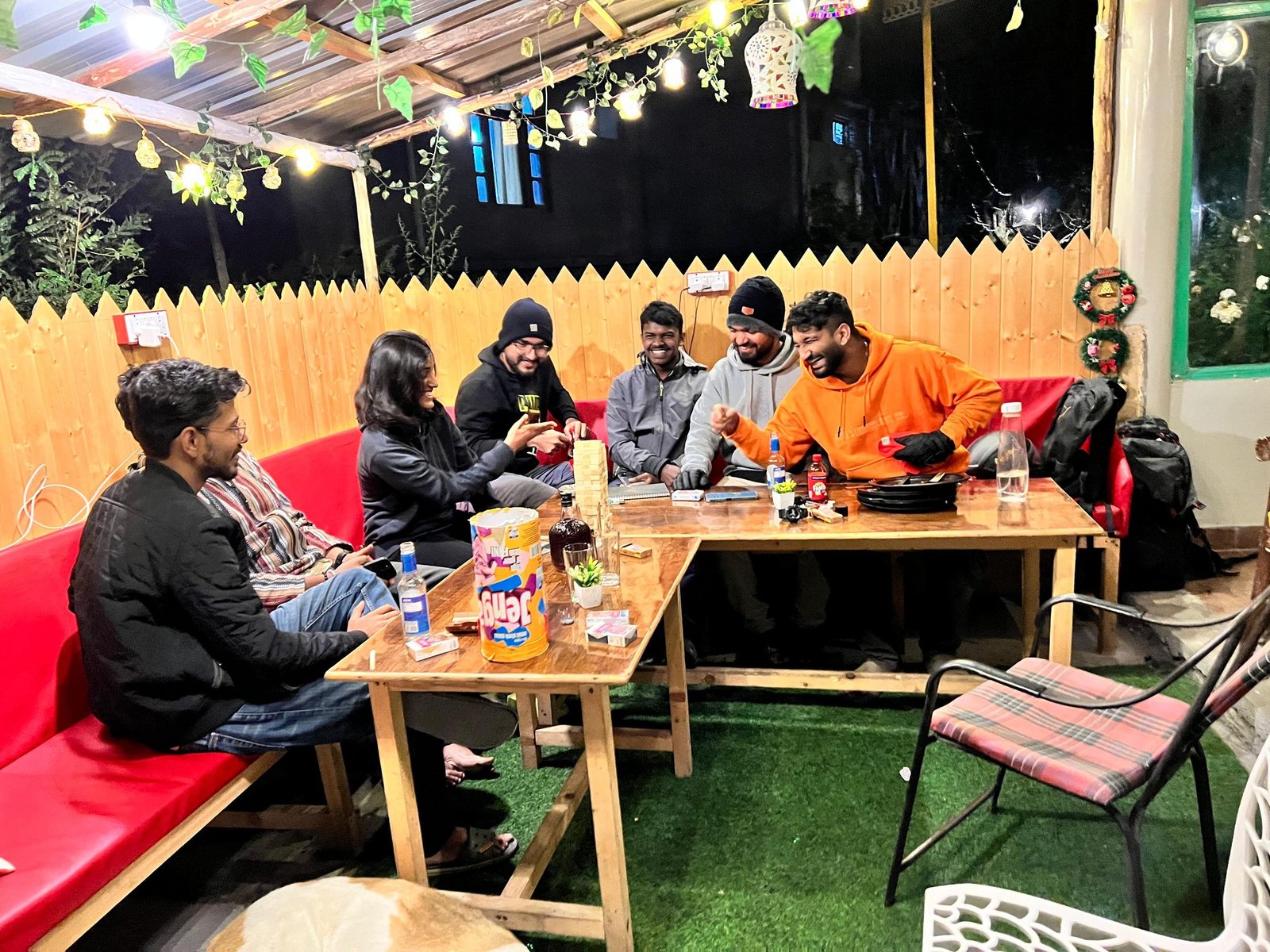 Safar guests playing board games together around café tables