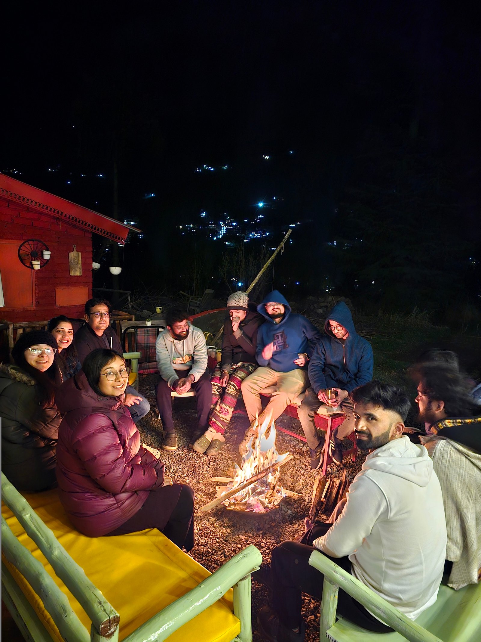 Guests seated around the Safar terrace bonfire