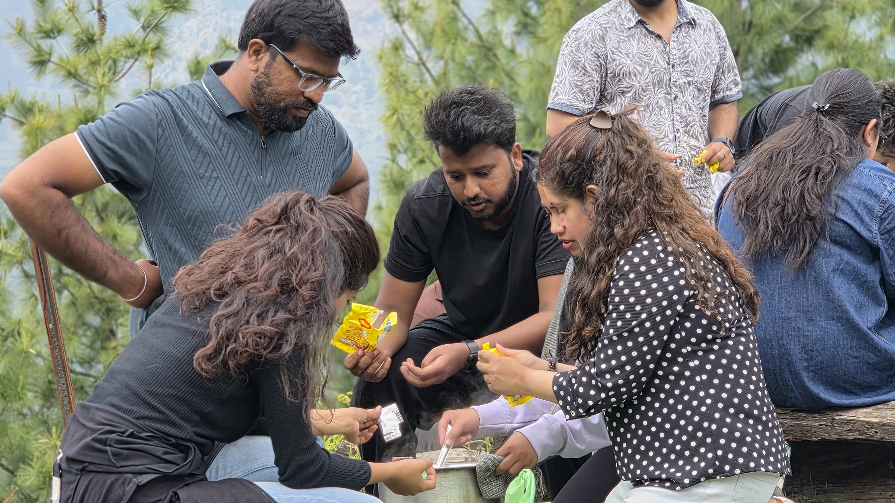 Safar guests preparing an outdoor meal together