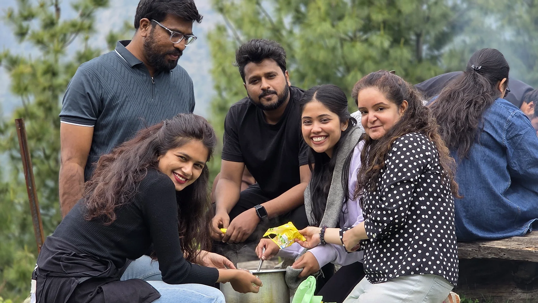 Guests preparing an outdoor meal together