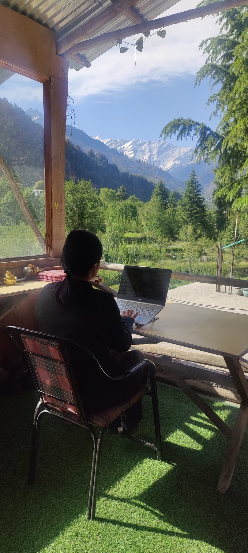 Guest working beside the mountain view at Safar